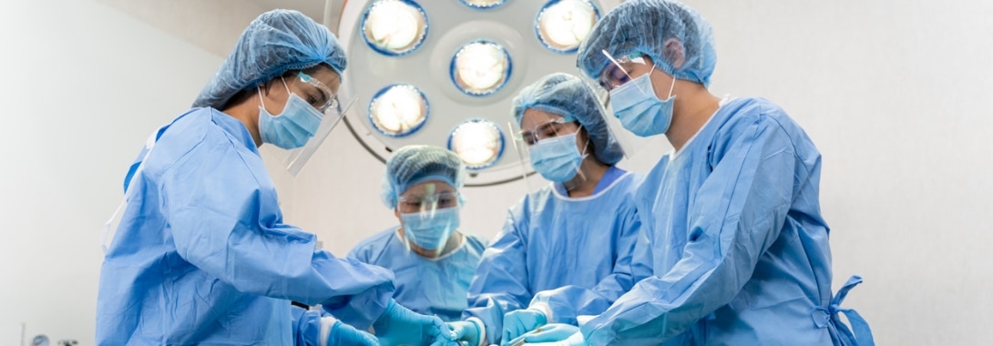 Four person surgery team utilizing ppe kits