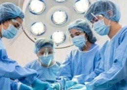 Four person surgery team utilizing ppe kits
